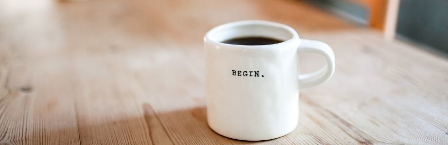 Mug with 'begin' written on