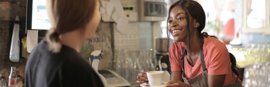Black woman working in coffee shop