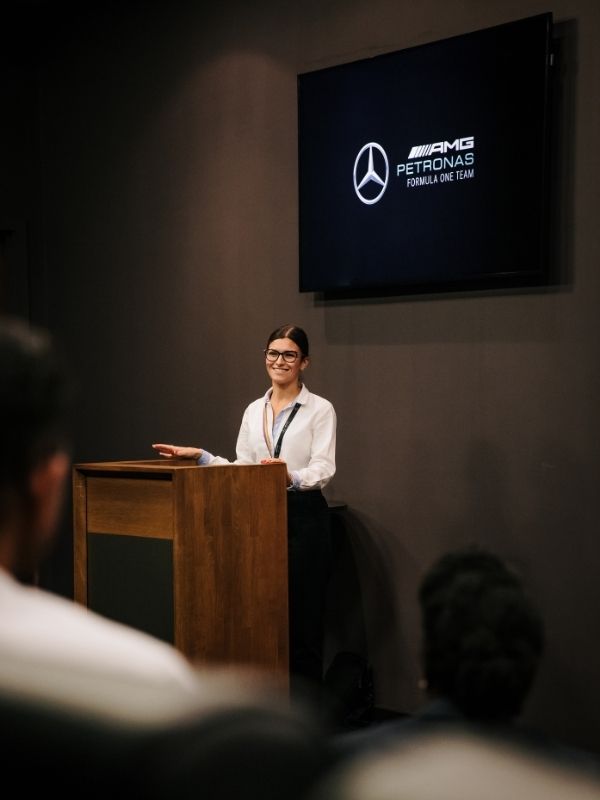 Ellie Watts, Diversity, Equality& Inclusion Coordinator at Mercedes-AMG speaking at an event